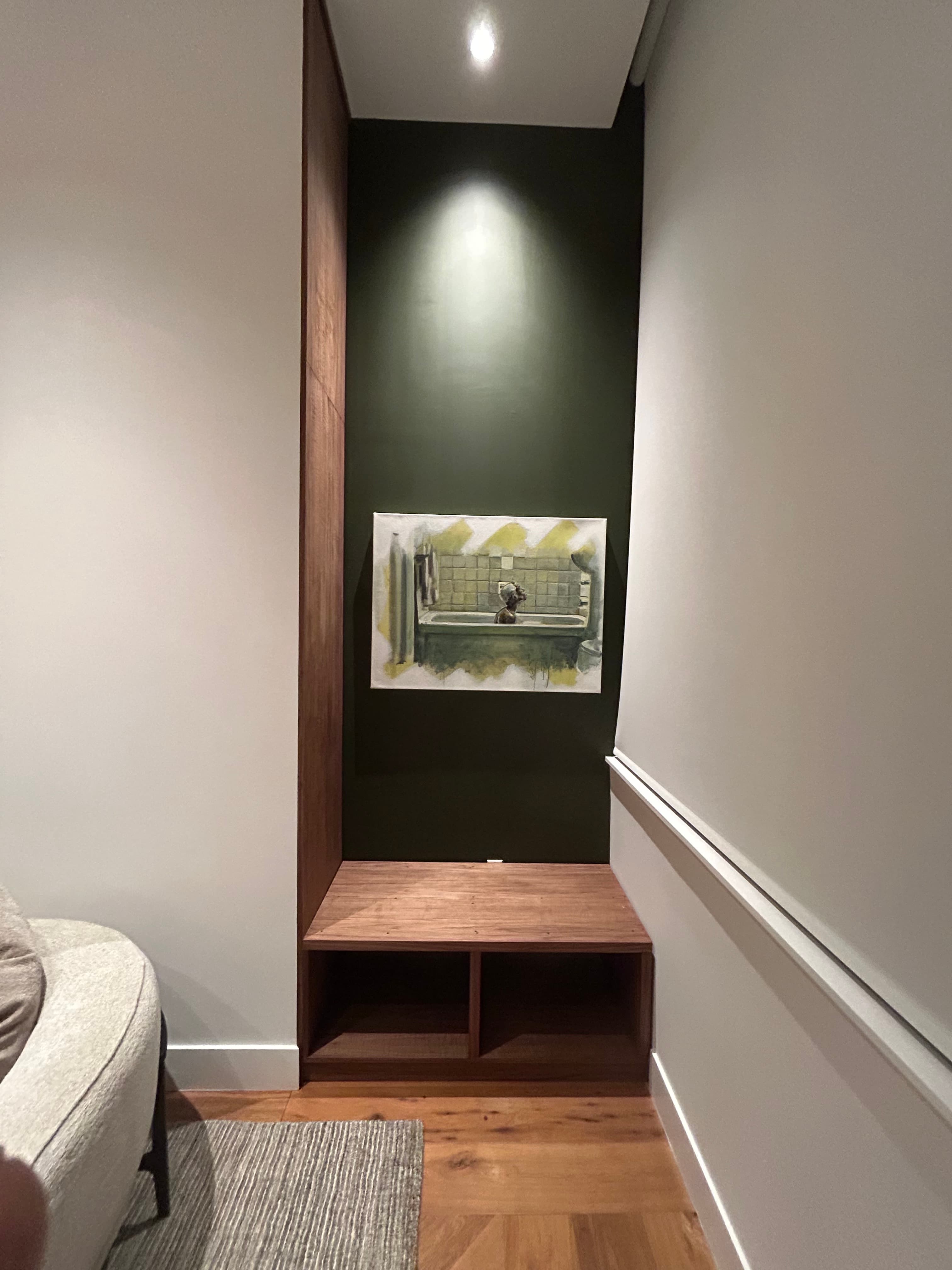 Built-in walnut floating shelf with reclaimed wood accent wall