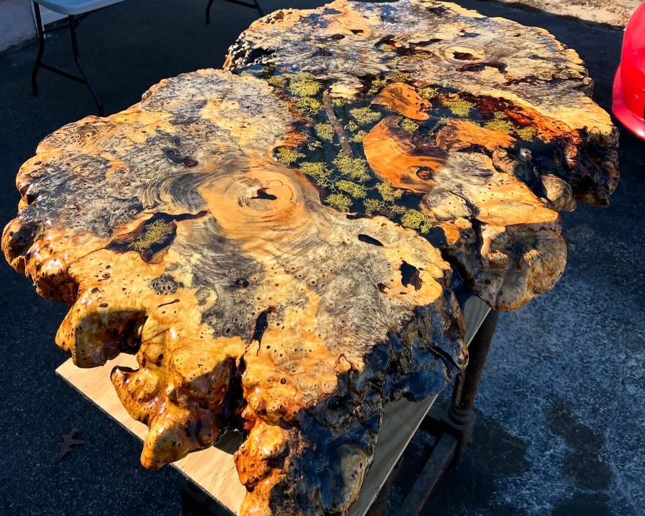 Burl wood and epoxy resin slab table with natural edges