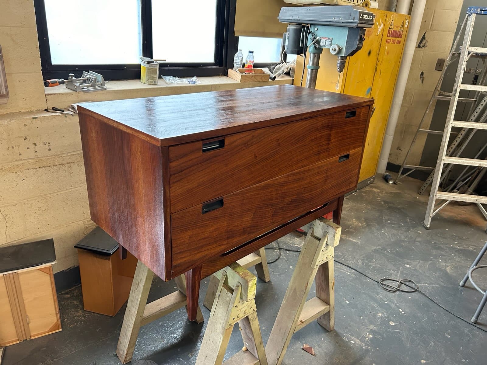 Mid-century modern walnut credenza with two drawers and tapered legs