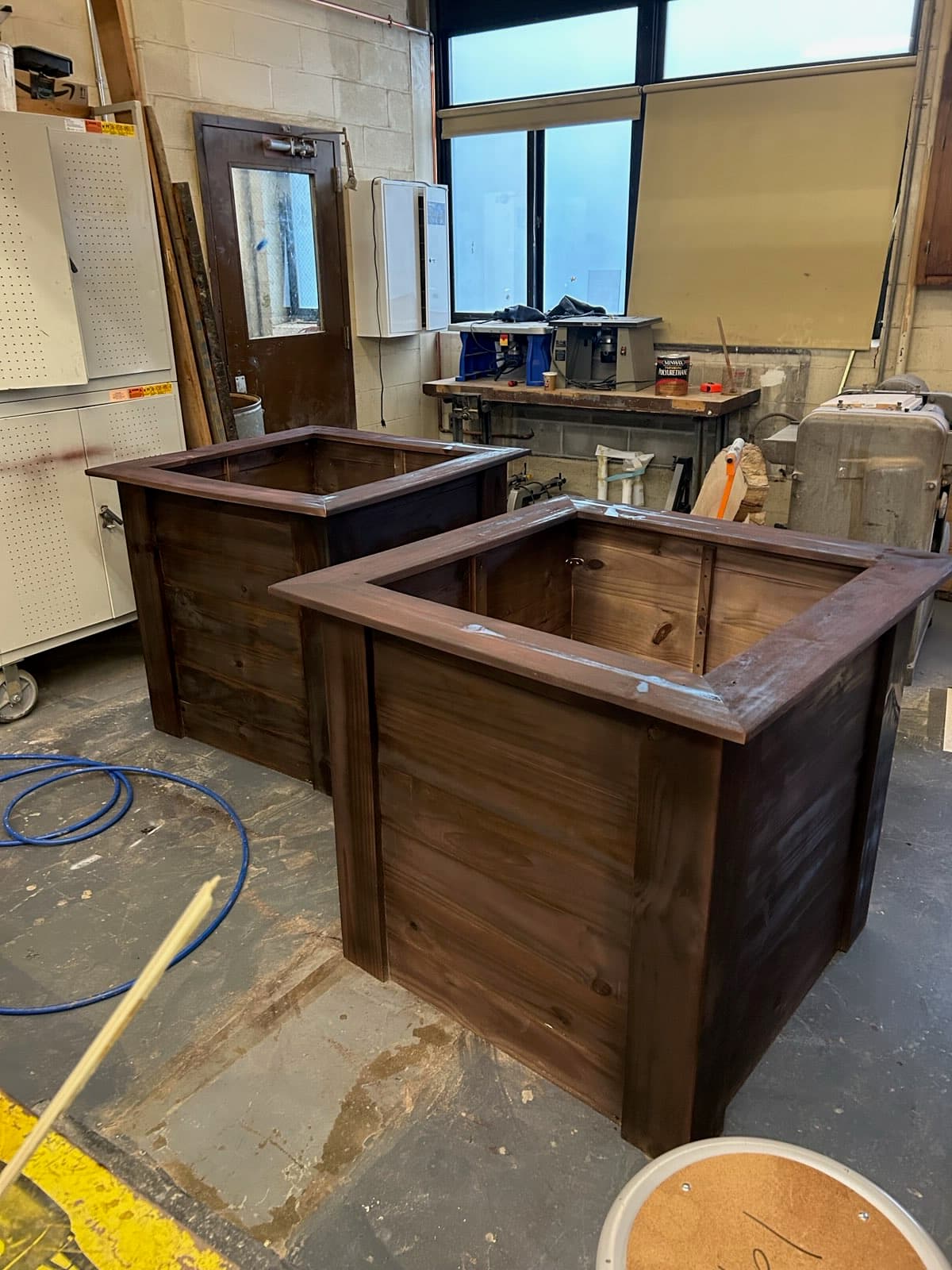 Rustic stained pine storage cabinet with custom hardware